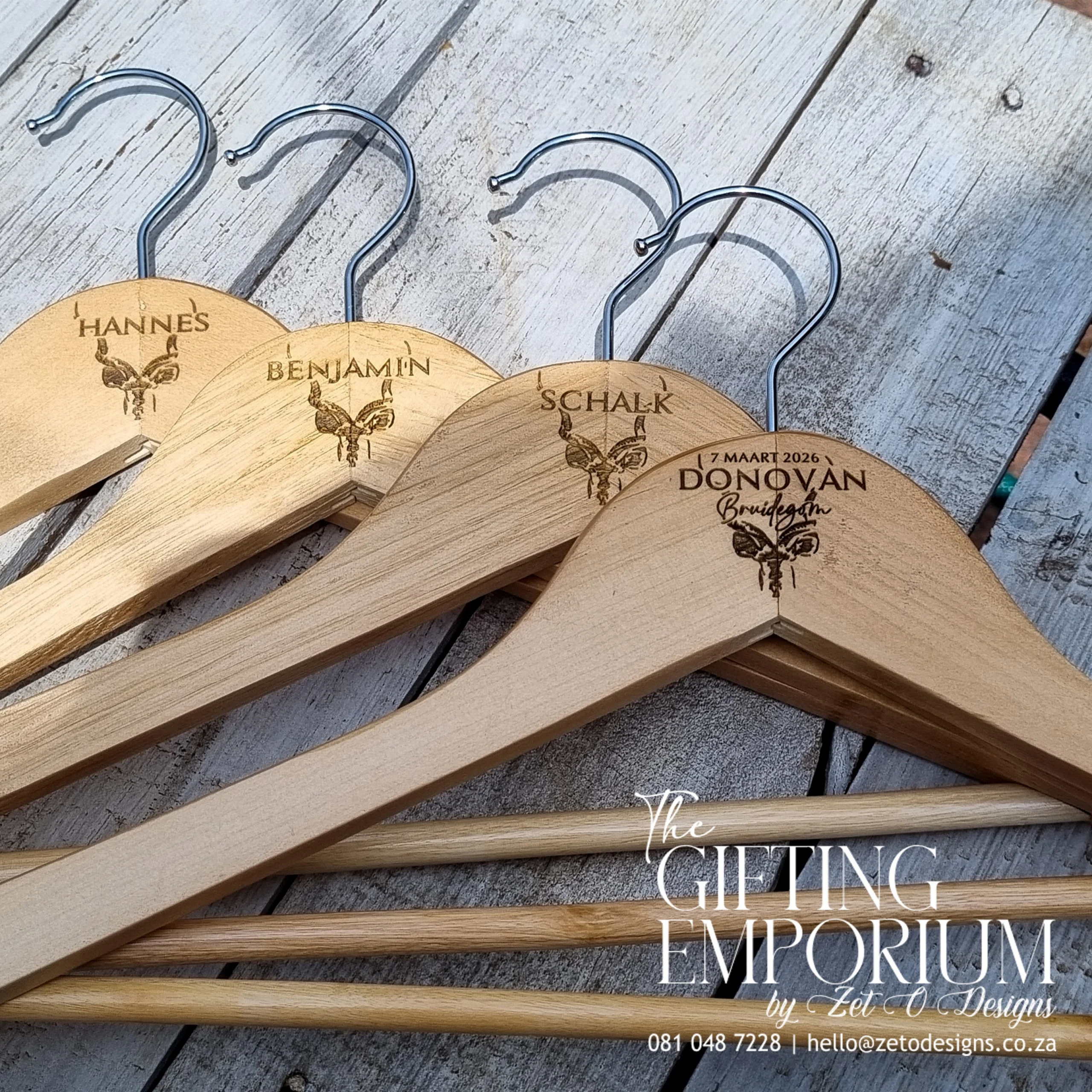 Luxury wooden suit hanger with African Kudu engraving.