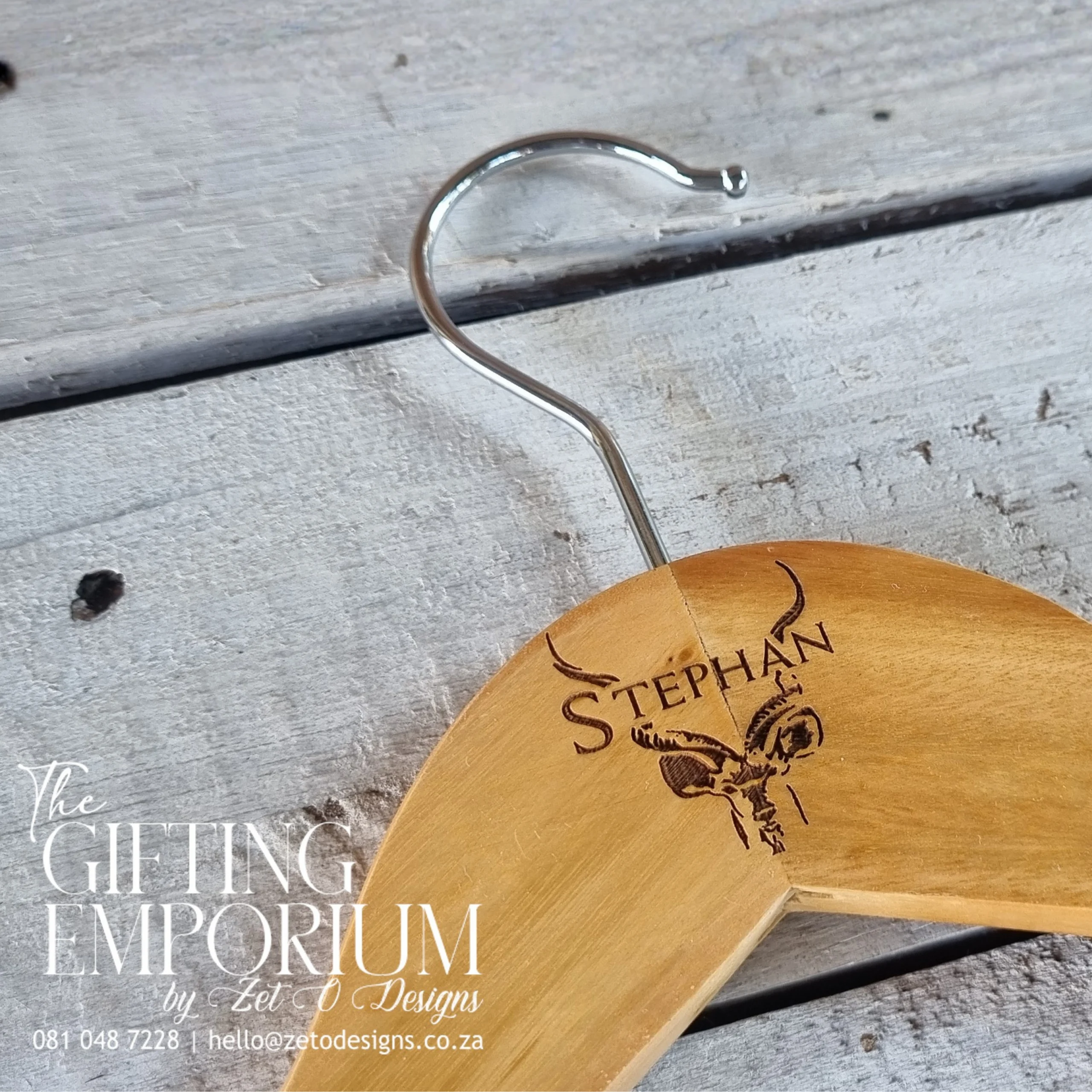 Groom's wooden hanger with custom wedding engraving.
