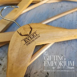 Wooden hanger with engraved buck horns motif, personalised for a wedding suit.