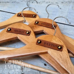Personalised wooden hanger with a genuine leather tag