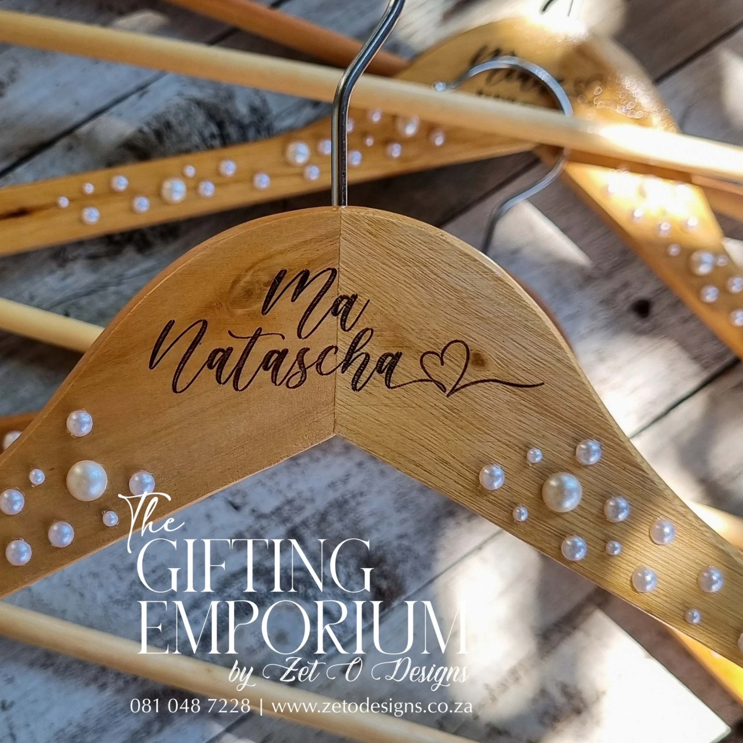 Wooden hanger with pearl details for a flower girl’s outfit