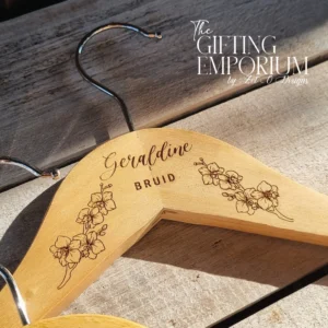 Personalised wooden wedding hanger with engraved orchid motif