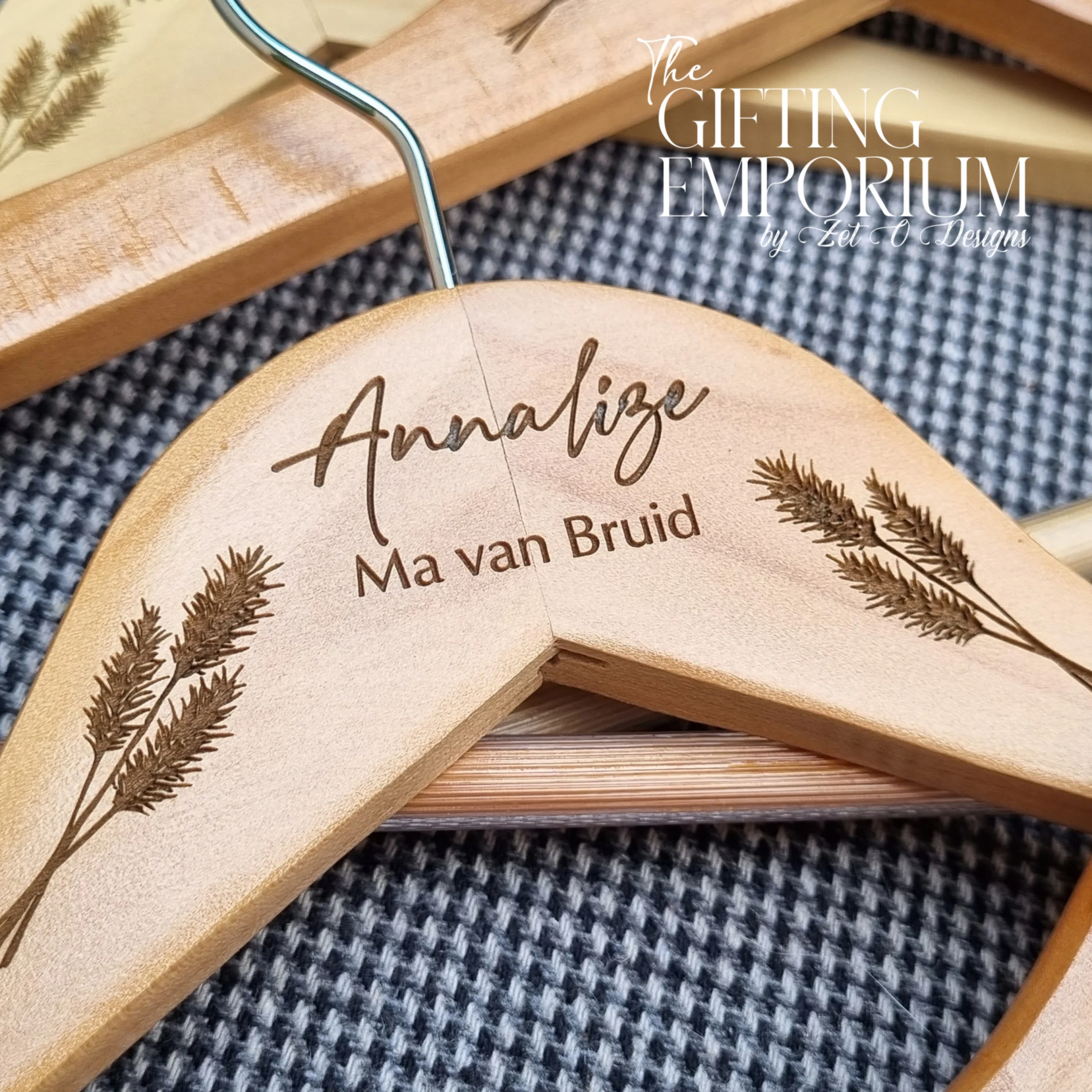 Close-up of the pampas grass engraving on a wooden hanger