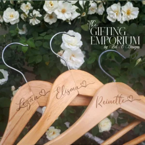 Personalised wooden hanger with a name and connected heart